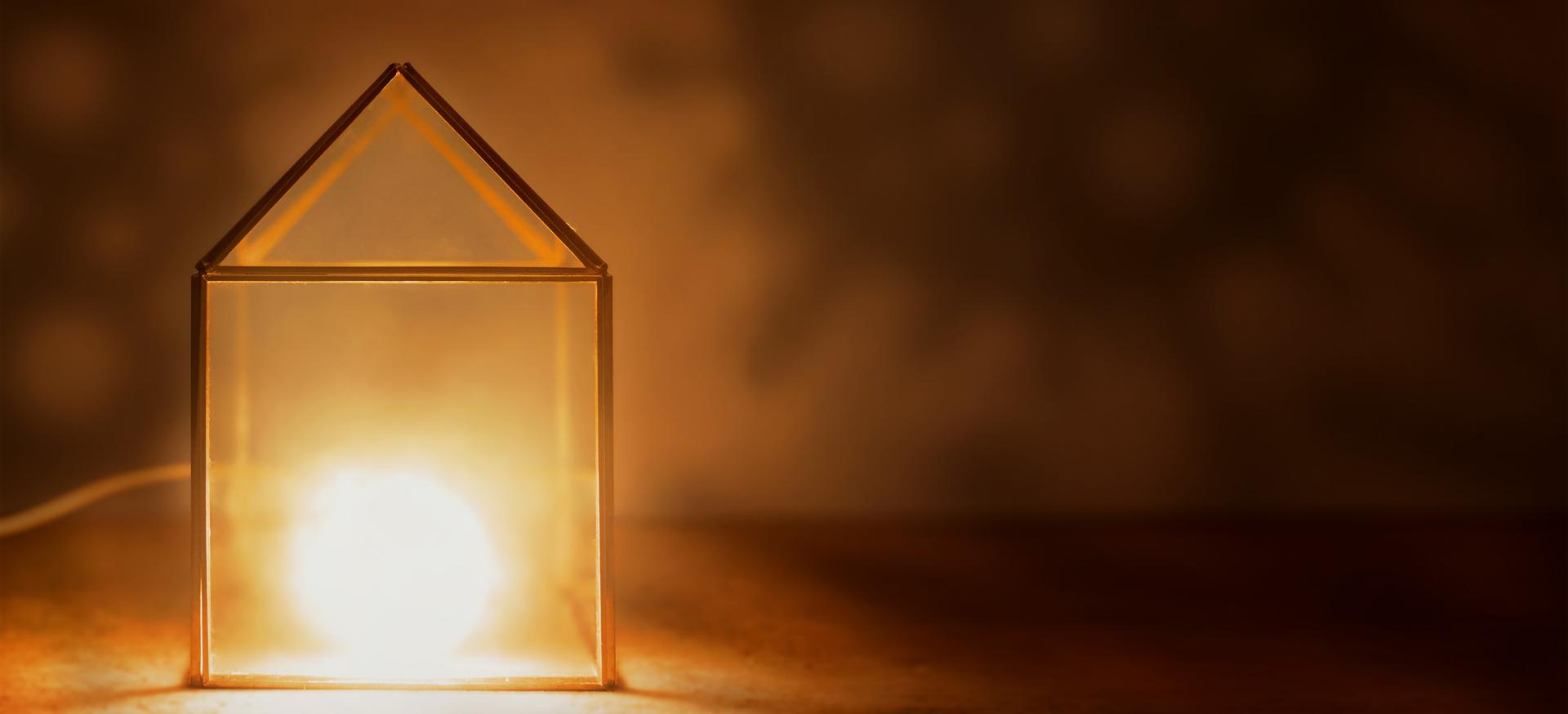glass house with light glowing inside